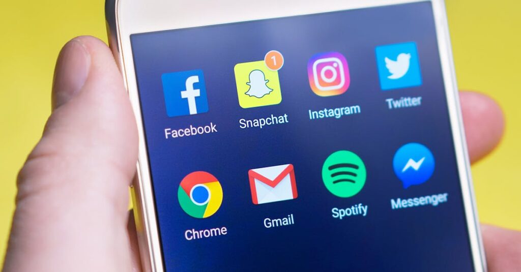 pexels-photo-533446-533446 A person's hand holding a smartphone displaying social media and communication apps.